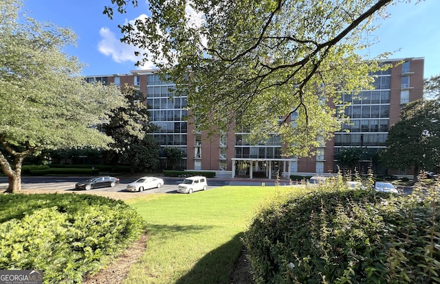 view of community featuring a lawn