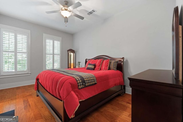 bedroom featuring ceiling fan and wood-type flooring