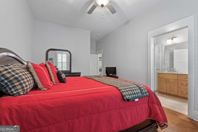 bedroom with ensuite bathroom, ceiling fan, and light hardwood / wood-style floors