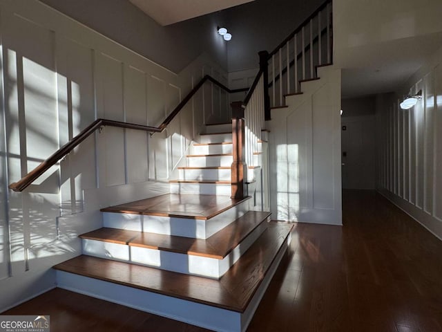 stairway featuring hardwood / wood-style flooring