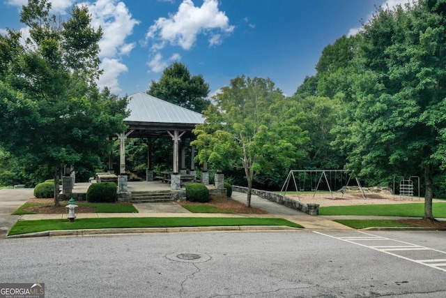 view of property's community with a gazebo and a playground