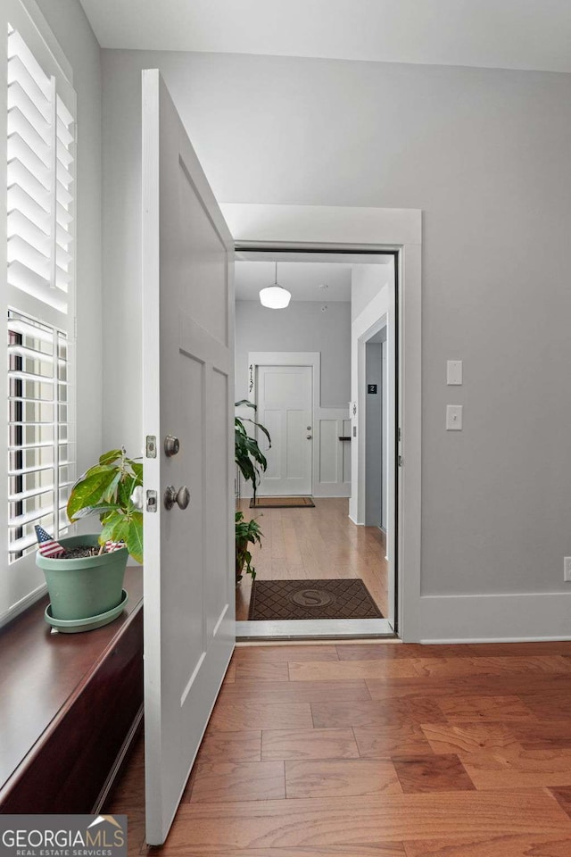 entrance foyer featuring hardwood / wood-style flooring