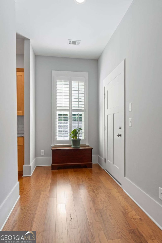 unfurnished room with light hardwood / wood-style flooring