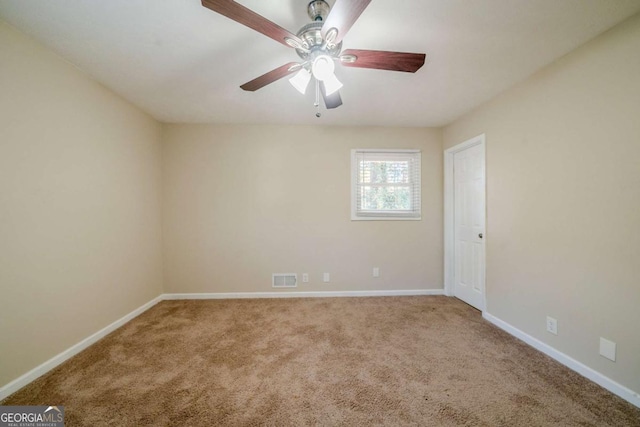 carpeted empty room with ceiling fan