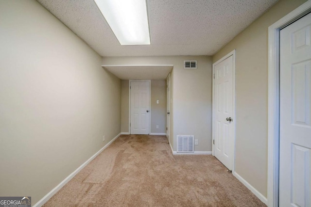 interior space featuring light carpet