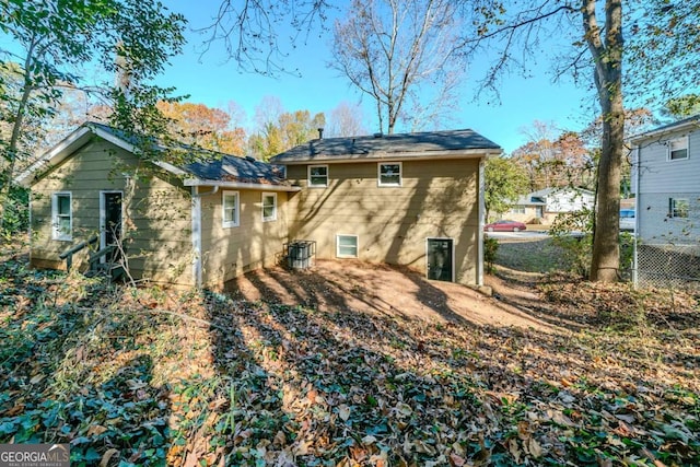 back of property featuring central air condition unit