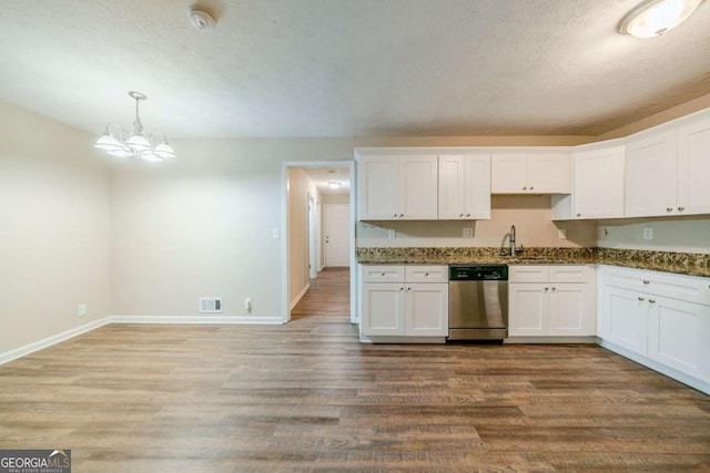 kitchen featuring hardwood / wood-style floors, dishwasher, white cabinets, hanging light fixtures, and a notable chandelier