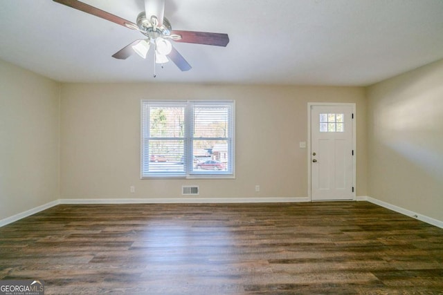 foyer entrance with ceiling fan and dark hardwood / wood-style flooring