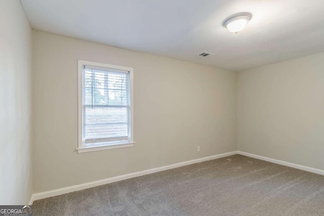 unfurnished room featuring carpet