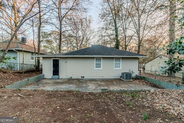 back of property with cooling unit and a patio area