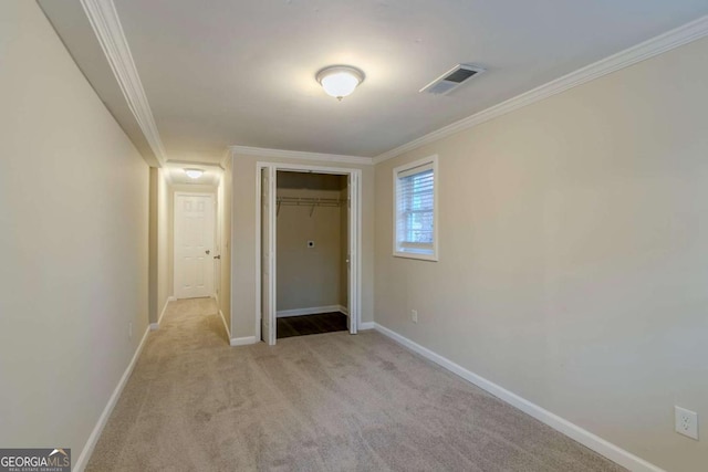 corridor with light carpet and crown molding