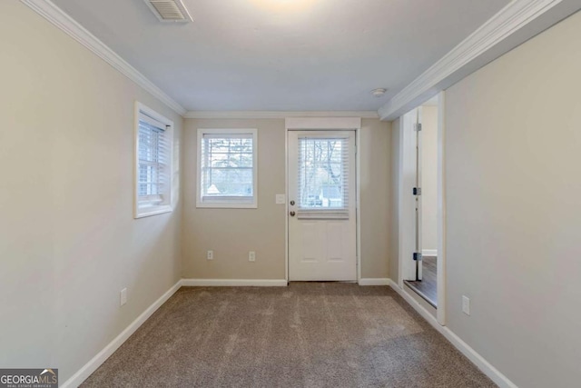 doorway with carpet floors and ornamental molding