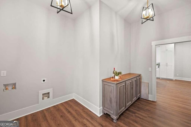 interior space with an inviting chandelier and dark hardwood / wood-style flooring