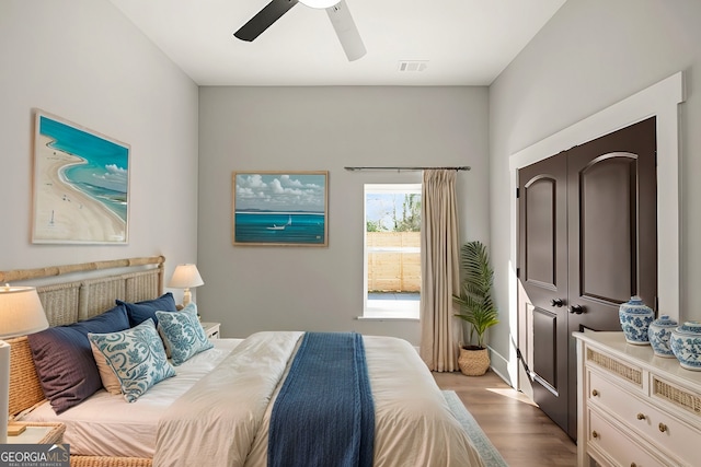 bedroom featuring light hardwood / wood-style floors and ceiling fan