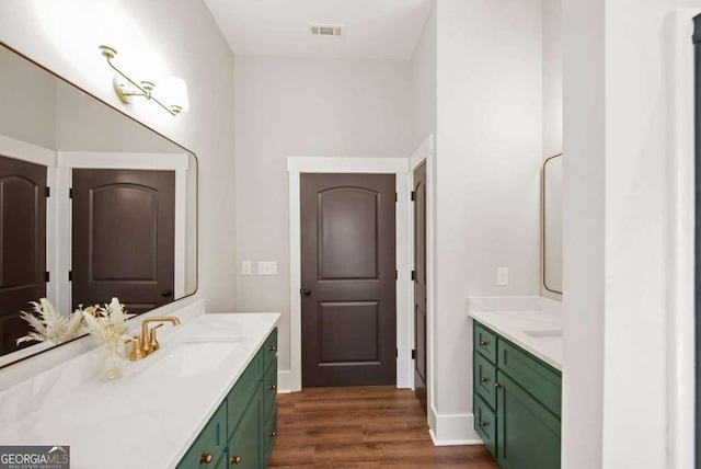 bathroom featuring hardwood / wood-style flooring and vanity