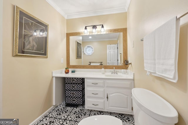 bathroom with tile patterned floors, vanity, toilet, and ornamental molding