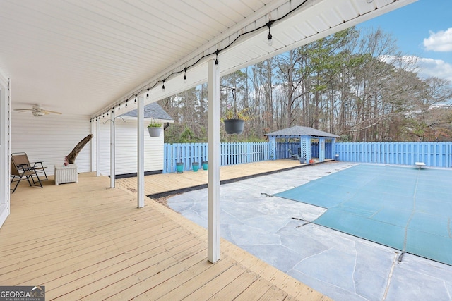 view of pool featuring ceiling fan