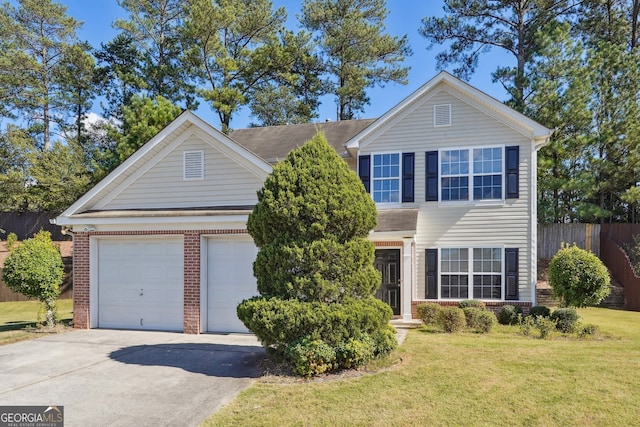 view of front of home featuring a garage and a front lawn