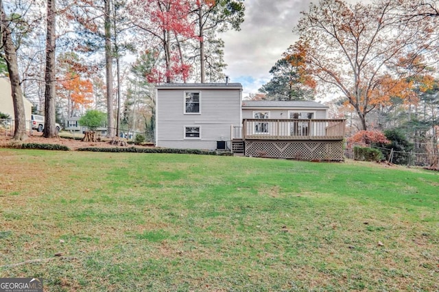 back of house with a lawn, central air condition unit, and a wooden deck