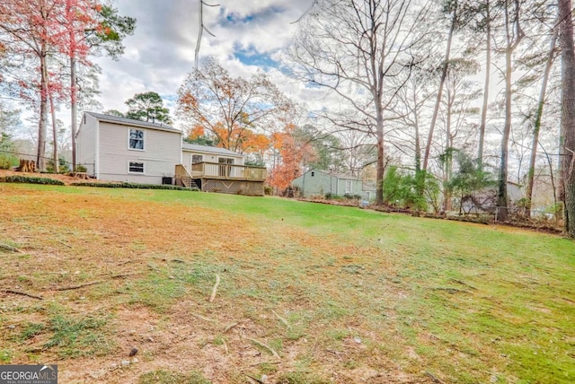 view of yard featuring a wooden deck