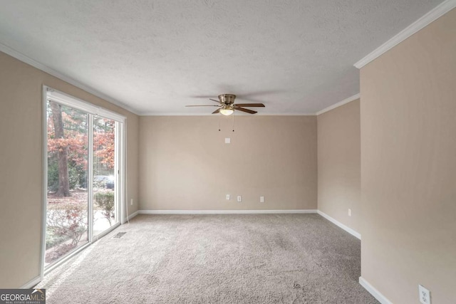 carpeted empty room with a textured ceiling, ceiling fan, and ornamental molding