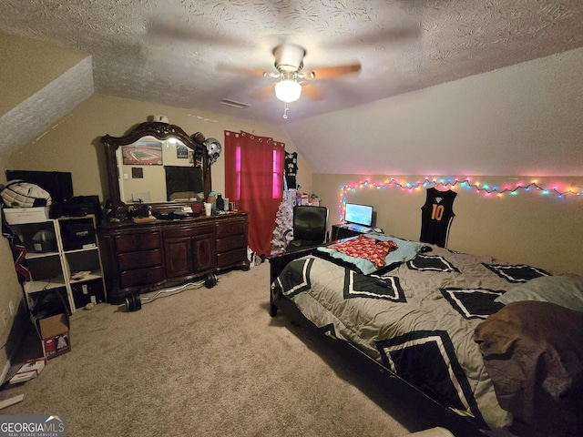 bedroom featuring carpet flooring, ceiling fan, lofted ceiling, and a textured ceiling