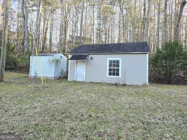 view of outbuilding with a lawn