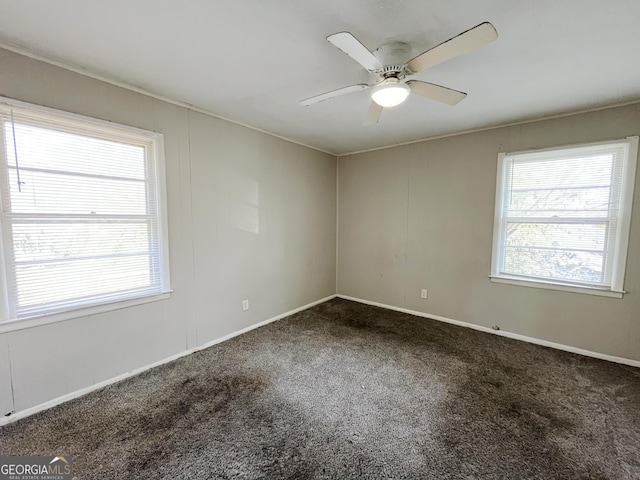 carpeted empty room featuring ceiling fan