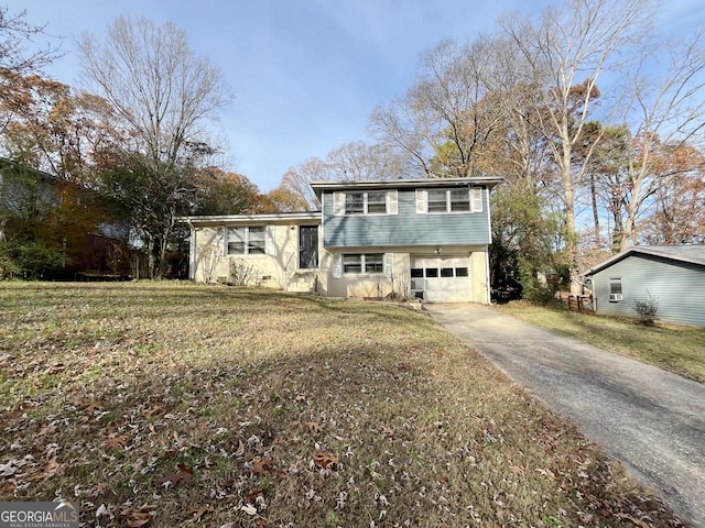 view of front facade featuring a front yard and a garage