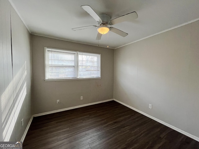 unfurnished room with ceiling fan, ornamental molding, and dark wood-type flooring