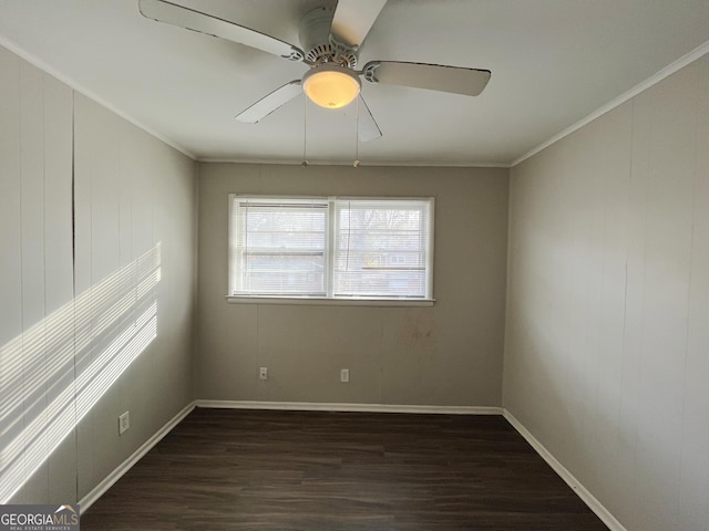 spare room with ornamental molding, ceiling fan, and dark hardwood / wood-style floors