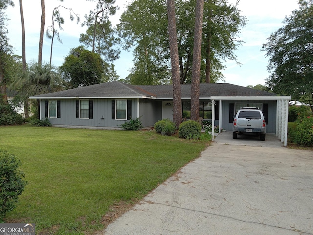 ranch-style house featuring a carport and a front lawn