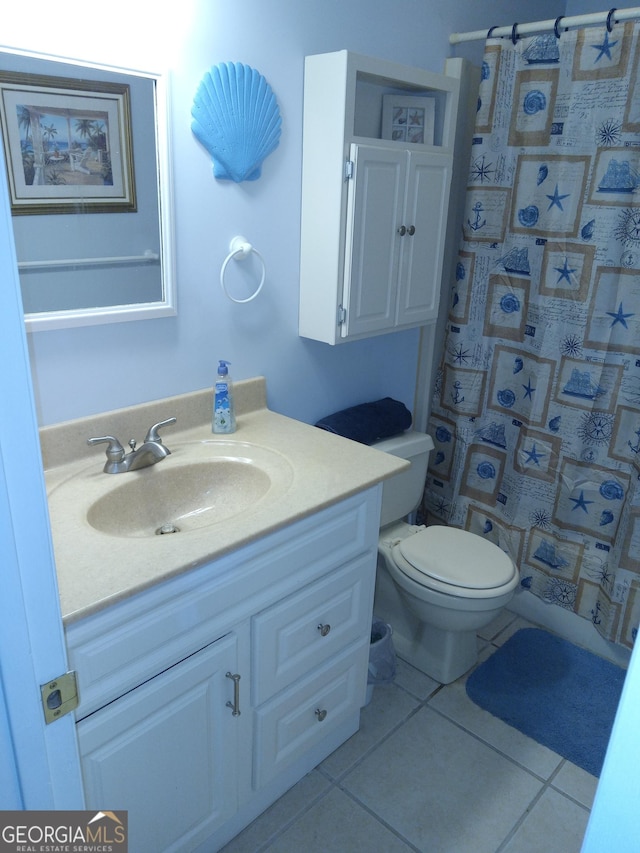 bathroom with toilet, tile patterned flooring, a shower with curtain, and vanity