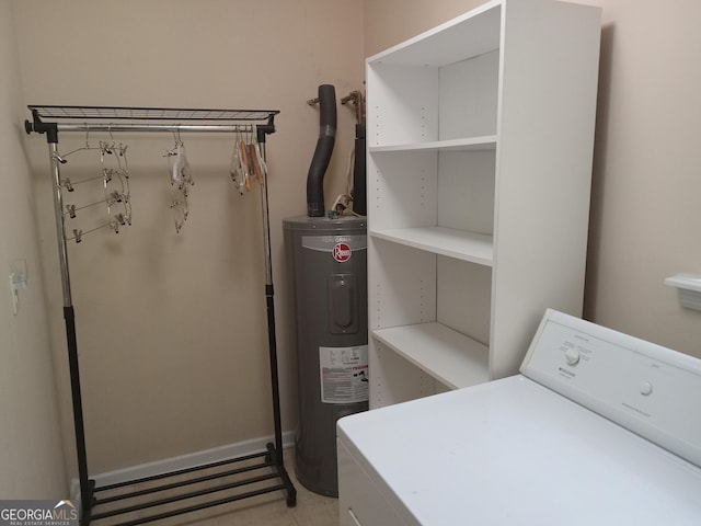 laundry room with water heater and washer / clothes dryer