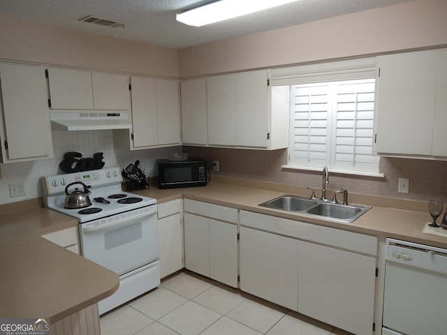 kitchen with sink, white cabinetry, white appliances, tasteful backsplash, and light tile patterned floors