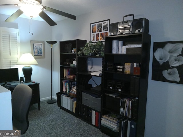 carpeted office space with ceiling fan