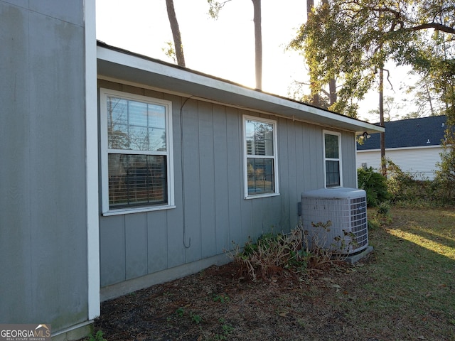 view of side of property with central AC unit