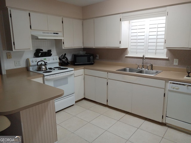 kitchen with white appliances, white cabinets, and sink