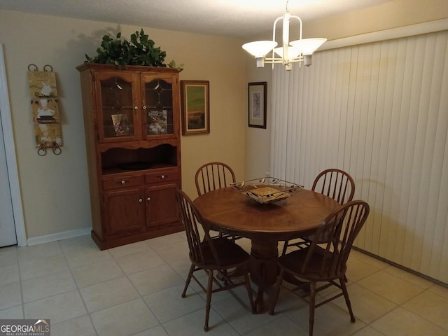 dining area with an inviting chandelier