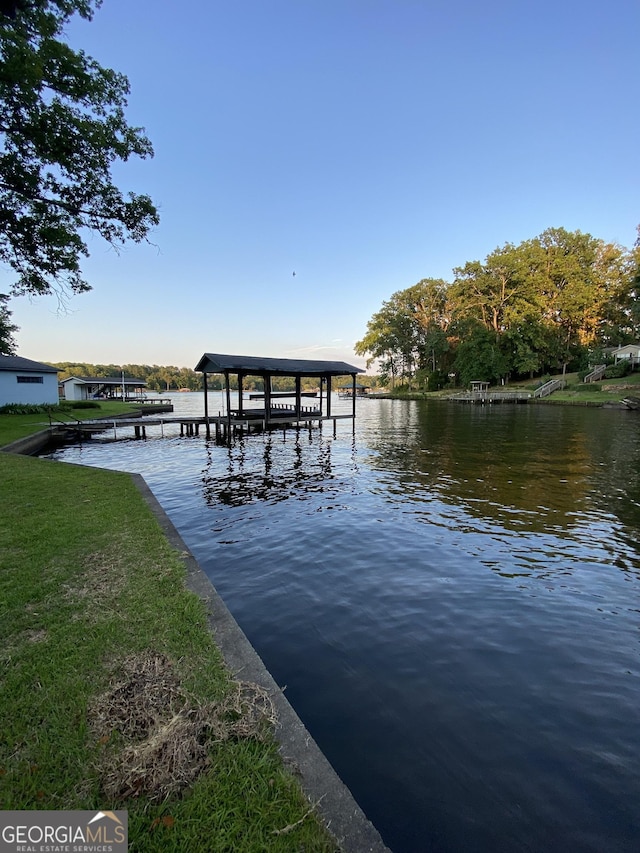 dock area featuring a water view