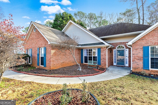 front facade with a front yard