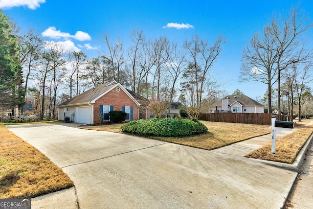 view of side of property with a garage and a yard