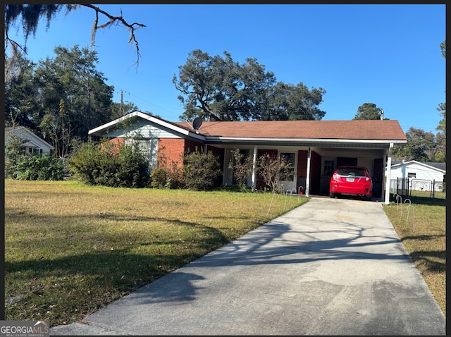 view of front of house featuring a front yard and a carport