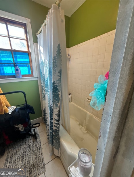 bathroom with shower / tub combo and tile patterned floors