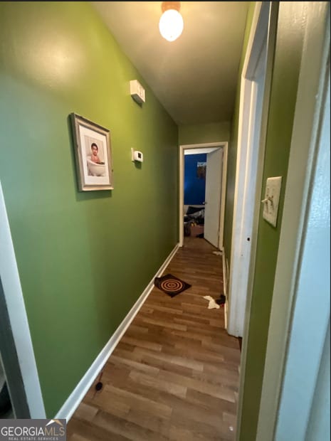 hallway featuring hardwood / wood-style floors