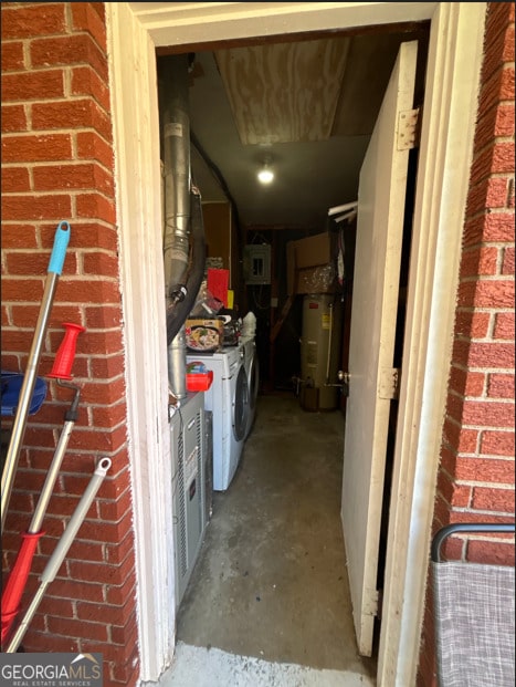 storage featuring electric water heater and washer and clothes dryer