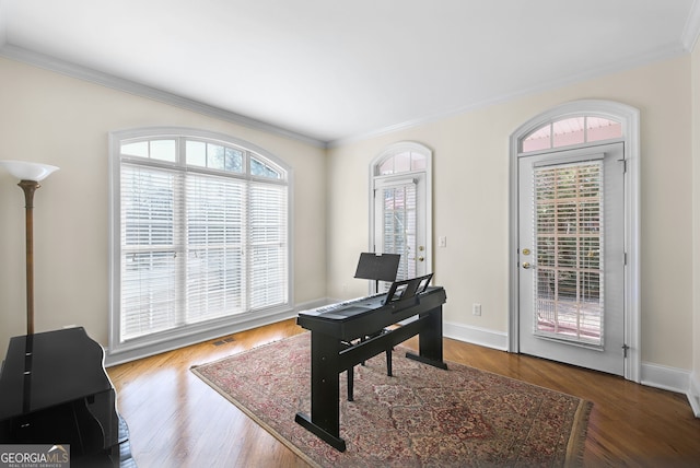 office with hardwood / wood-style floors and ornamental molding