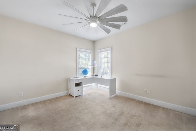 unfurnished office featuring light colored carpet