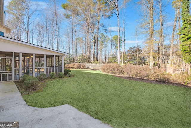 view of yard featuring a sunroom