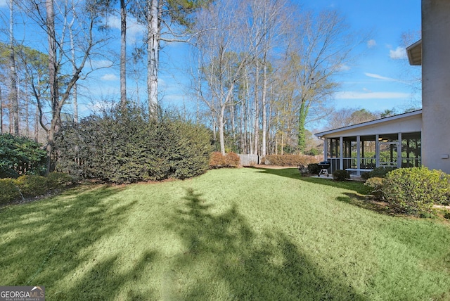 view of yard featuring a sunroom